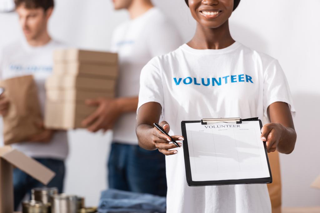 stock-photo-selective-focus-african-american-volunteer stock-photo-selective-focus-african-american-volunteer